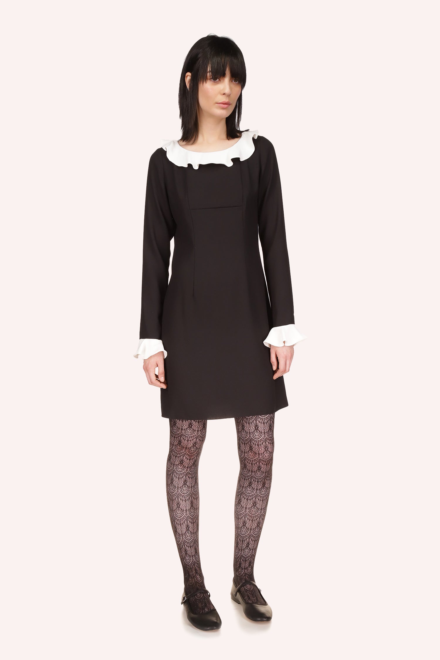 right of a Black Dress, above-the-knee, long sleeves/collar borders vanilla crepe 