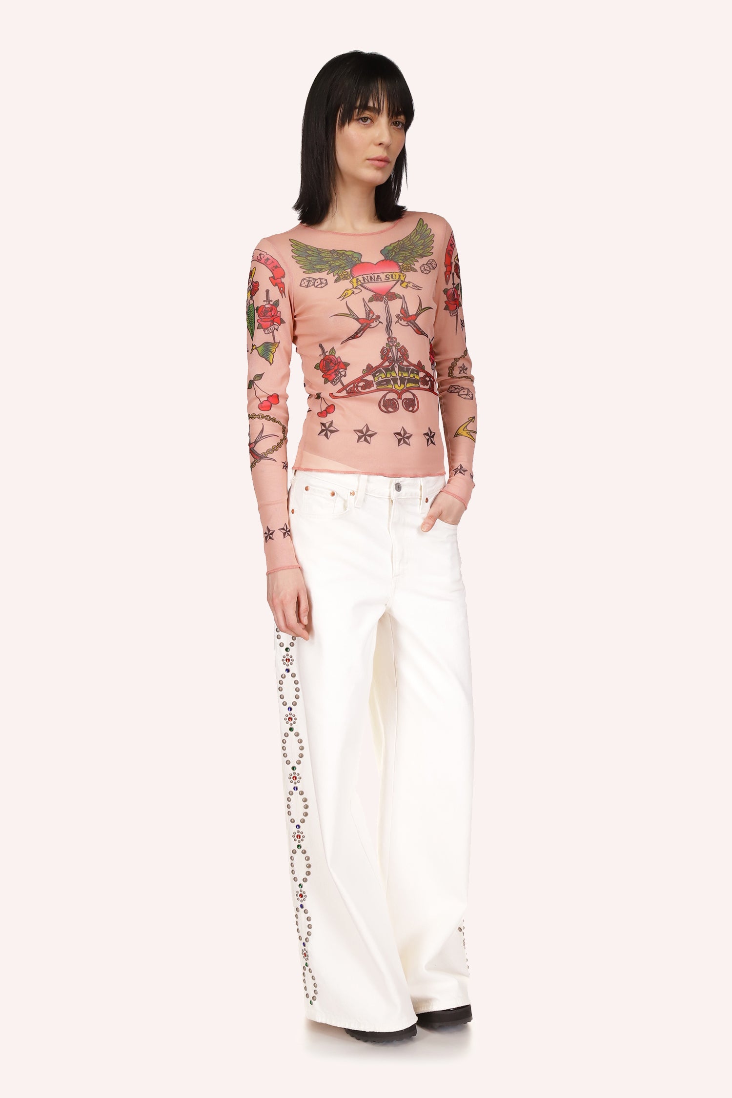 The Anna Sui Tattoo Mesh Top Nude Multi is with its long sleeves and tattoo-like patterns