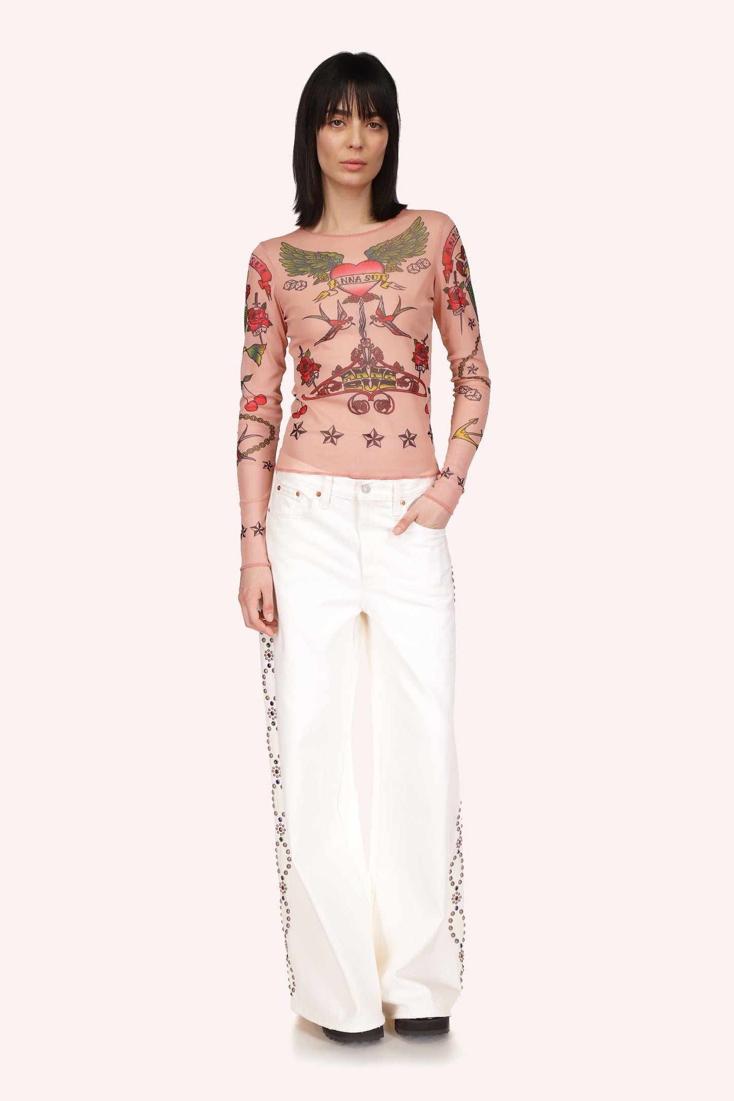 White jean, 2-pockets, zipper, wide legs, oval studded shapes, with silver/copper, top to bottom