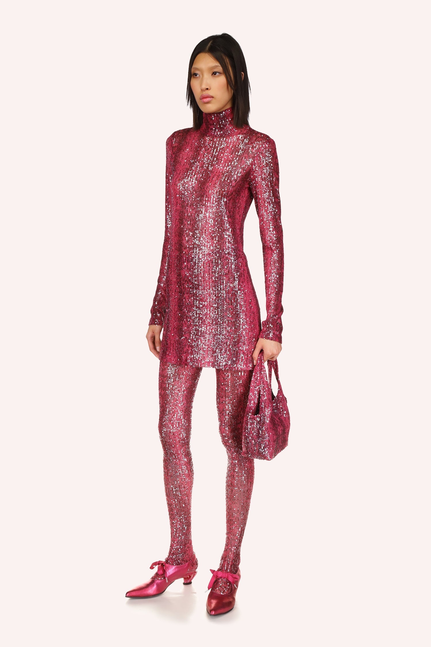 This glamorous long sleeves, turtleneck mini dress, shiny ruby red color is designed with the finest attention to detail