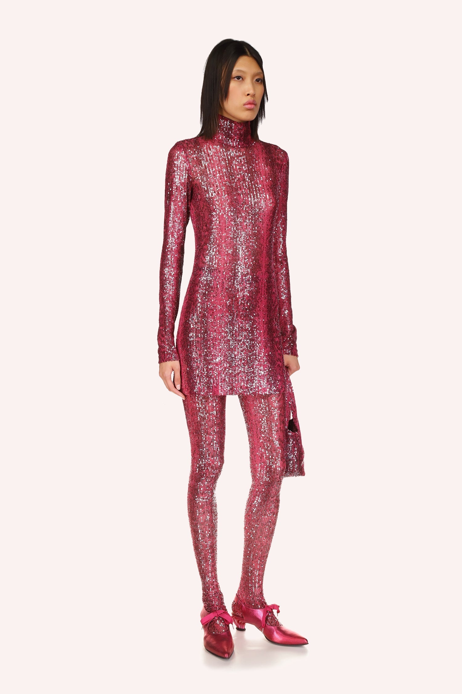 Introducing the exquisite Snakeskin Sequin Turtleneck Dress, a true work of art that will make you the center of attention at any event