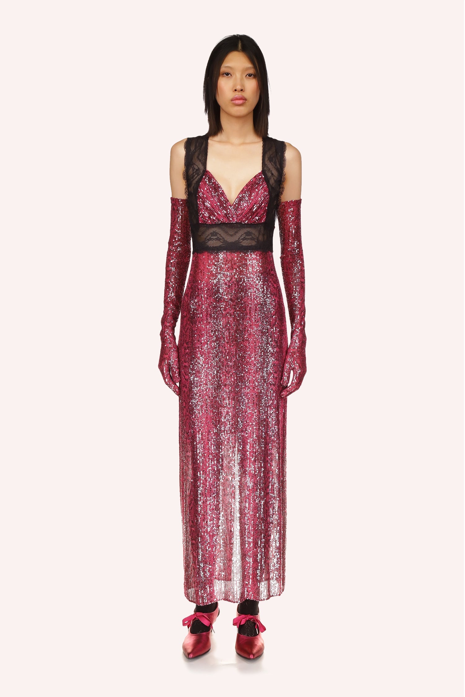 Anna Sui's Red Snakeskin Dress is a long V-neck cut dress with black lace under the bust and over the shoulder