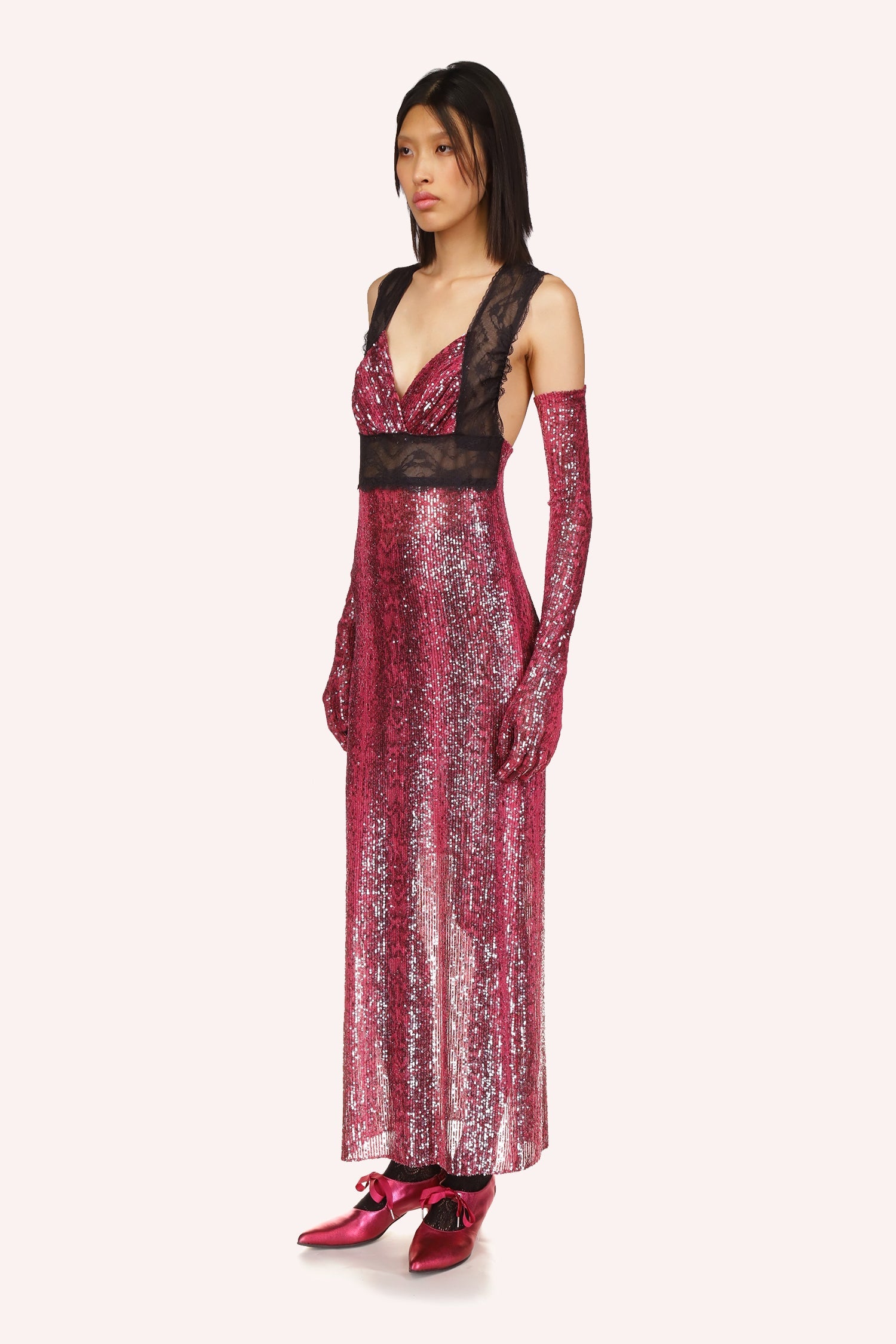 Long V-neck cut, shiny red, large see-through black lace under the bust pass over the shoulder, ankles-long