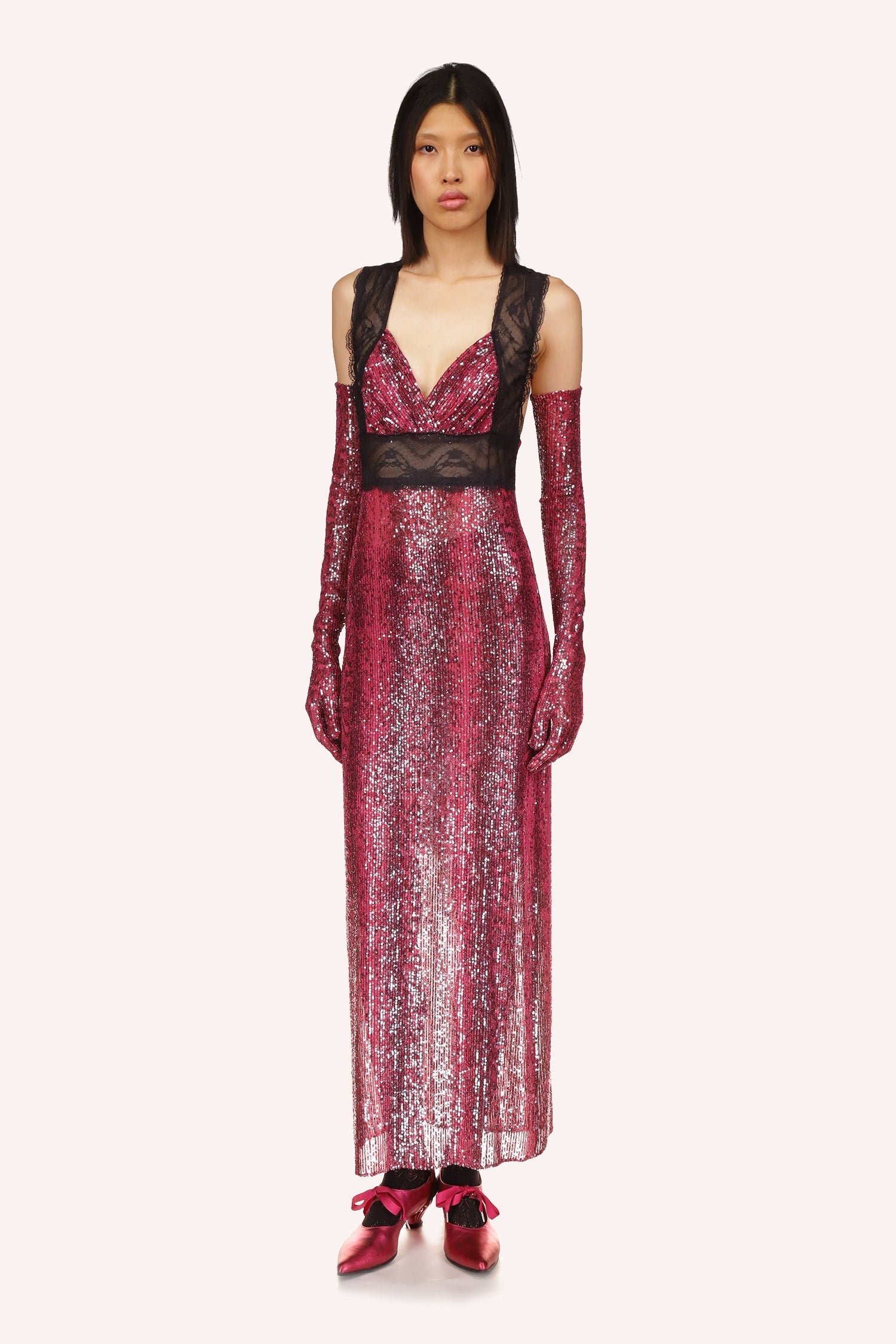 Anna Sui's Red Snakeskin Dress is a long V-neck cut dress with black lace under the bust and over the shoulders