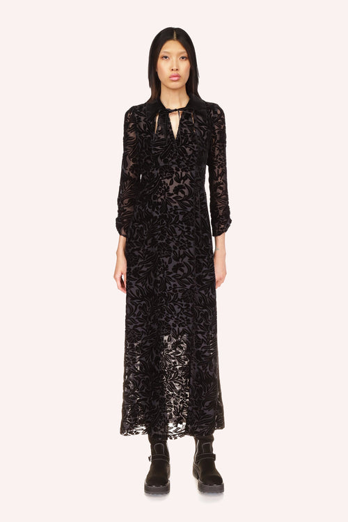 Ankle-length Dress has a V-cut collar with lace fastening, long sleeves, floral pattern on transparent texture