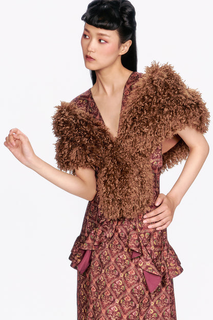 Woman wearing a Wallpaper Medley Maxi Dress in fall colors with a fluffy brown top. 