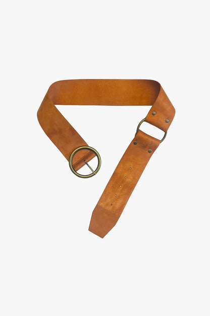 Tan suede belt with a gold buckle on a white background.