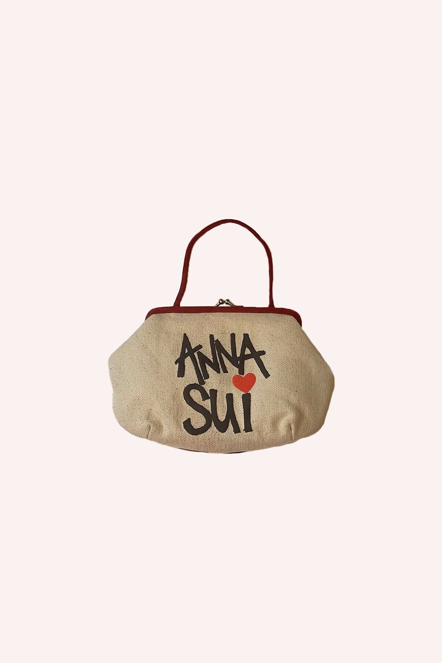 Mini purse light cream, Anna Sui branding on the other side