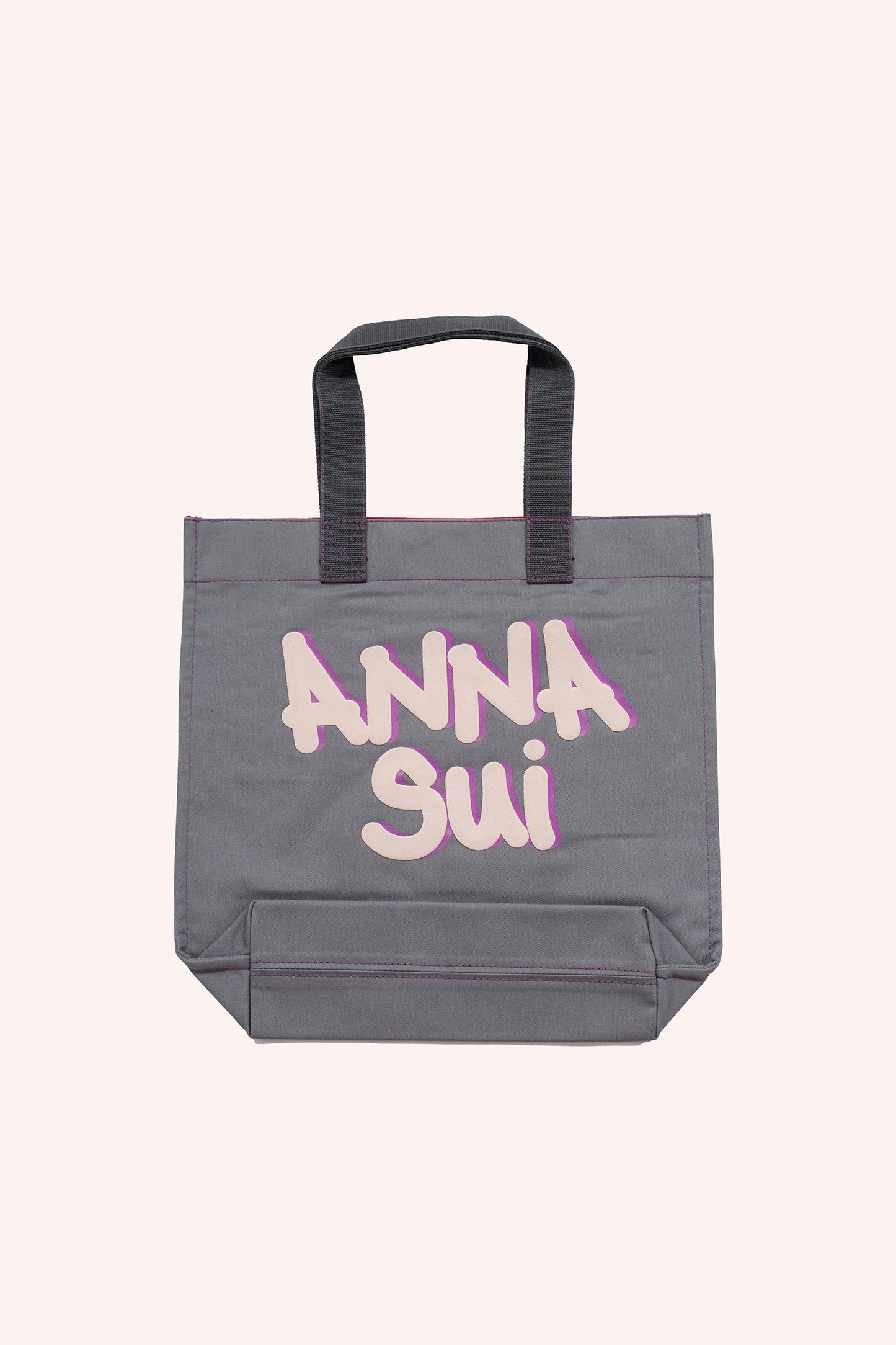 Tote bag, squared, darker grey handles, red stiches lines, Anna Sui branding on the other side
