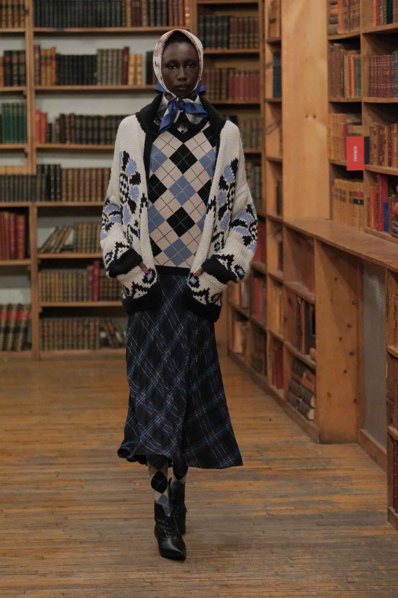 In a library, the Bloomsbury Cardigan attire with pairing outfit looks comfy for winter