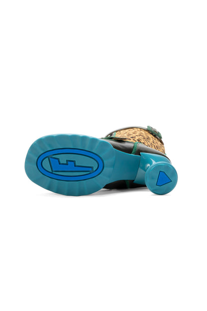 Fluevog’s signature sculptural heel sole in plight with a darker blue F logo in an oval.