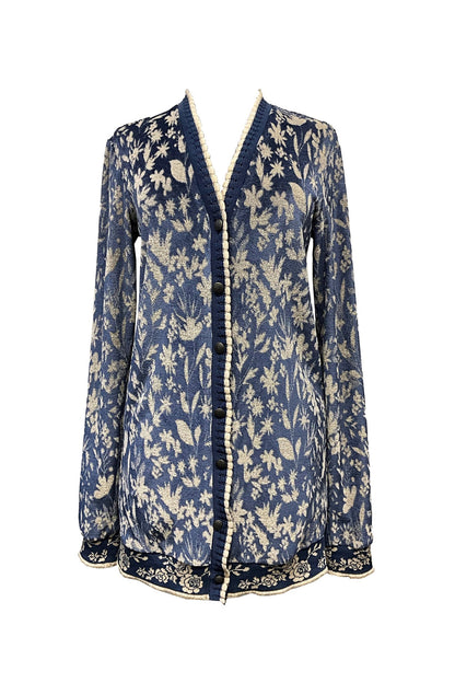 Blue hems with white lace borders on the White Floral Bluebell Design Velour Cardigan