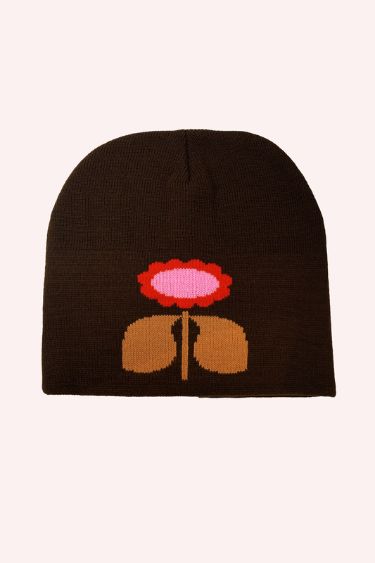 Daisy Beanie hat is a dark caramel color, features a stylized red and rose daisy with a beige stem