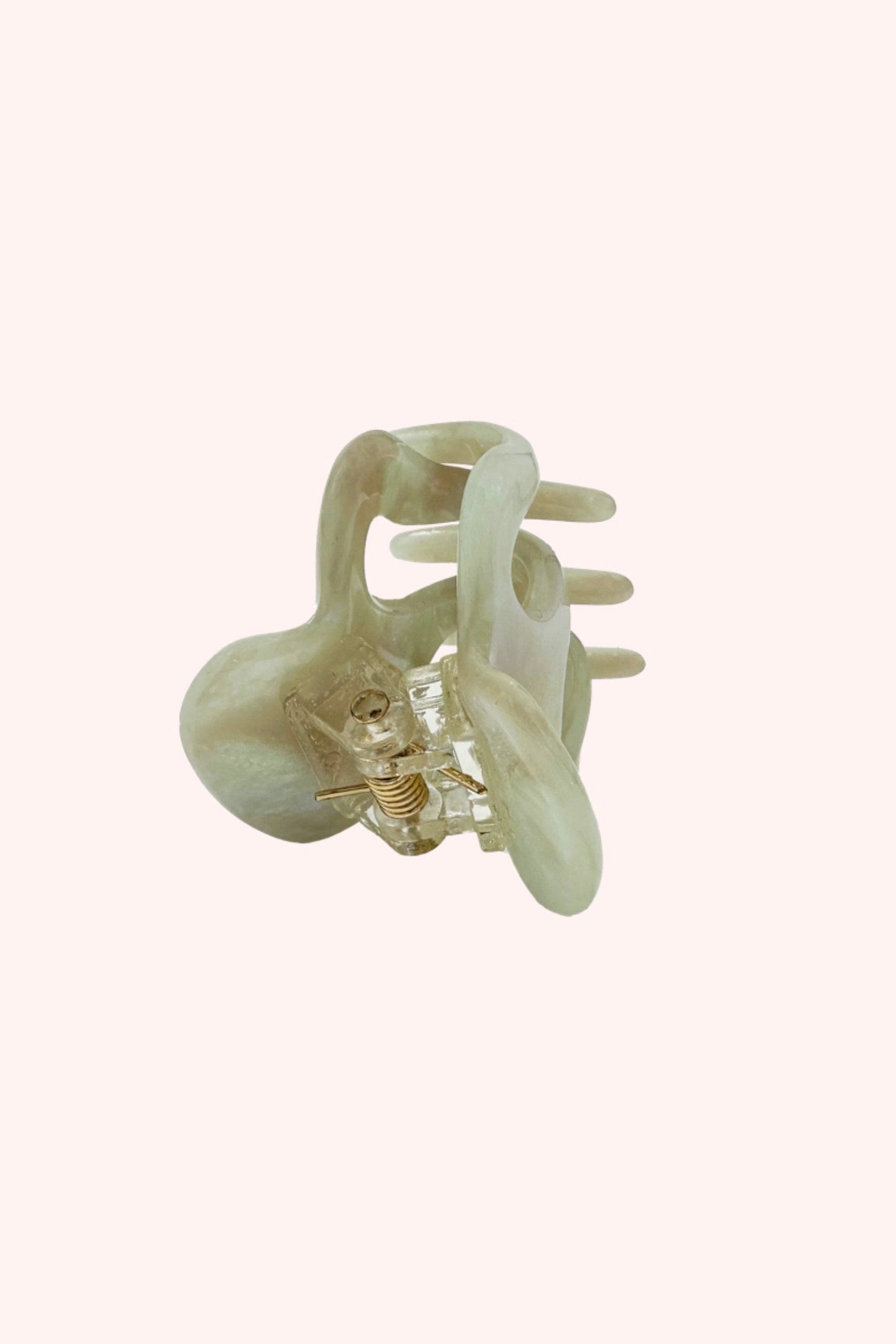 Mini Jaw Clip, design in the shape of a hand with three fingers interlaced with the opposite side
