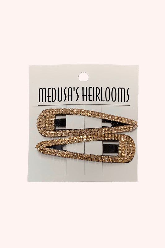 Snap Clip, pair of hollow arrowheads, with golden rhinestones edges, on Medusa’s Heirlooms display