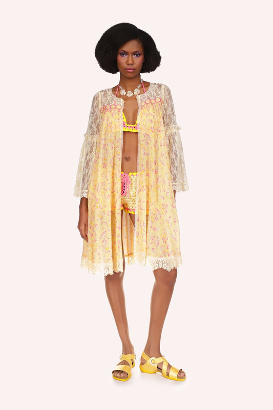 Arcadia Blossom Lace Cover Up is in yellow color at center, arms are laced see-thru, with red print