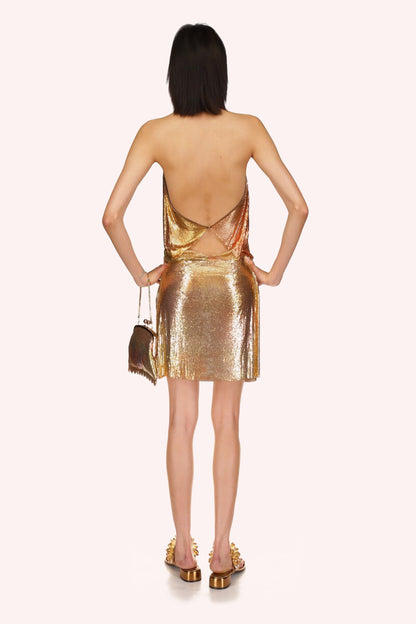 Golden skirt, straight-cut and fitted to the body with ruffle details, touch of femininity and flair