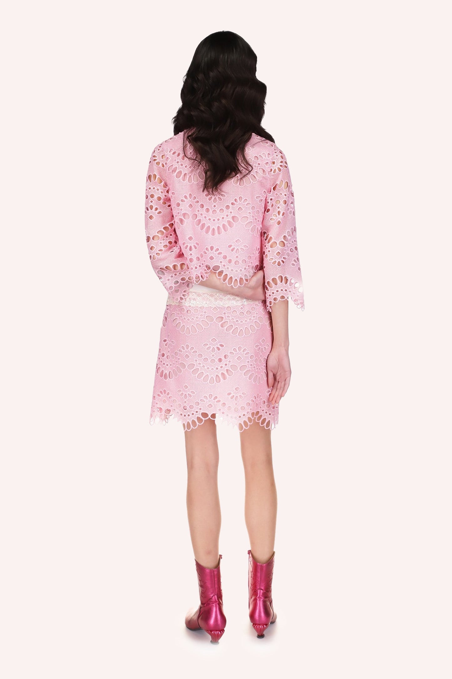 Eyelet Skirt, pink with from small to large oval eyelets, wavy bottom hem.