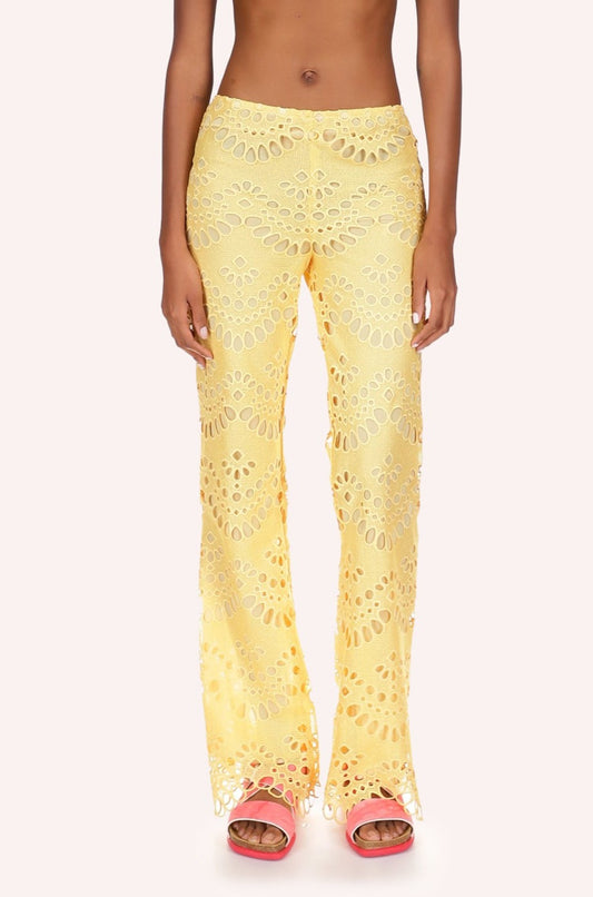 Eyelet Pants yellow with from small to large oval eyelets in a round shaped alignment