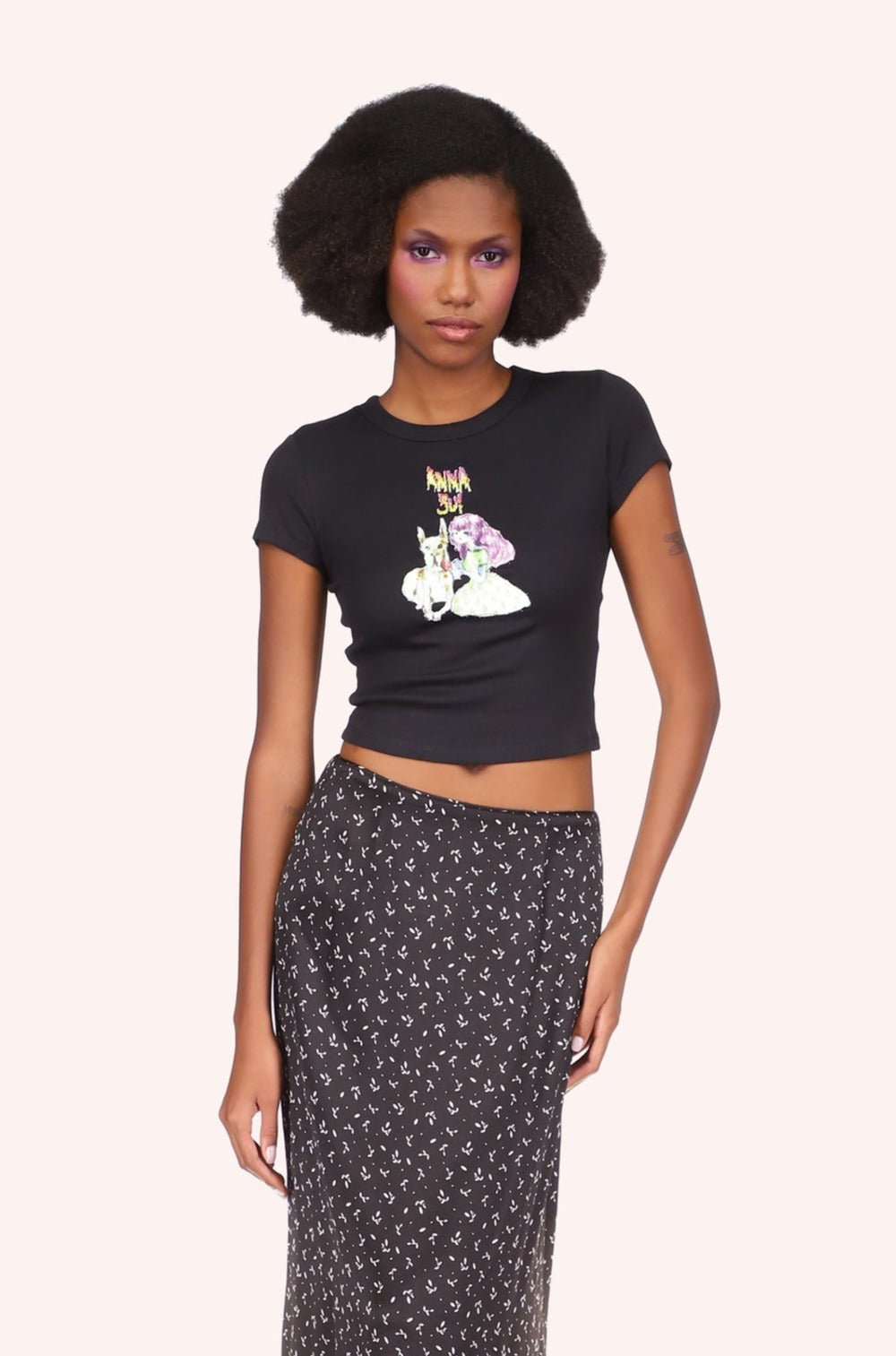 Tee Black, Short-sleeved, above hips, Anna Sui logo above a stylized little girl with a large white dog.