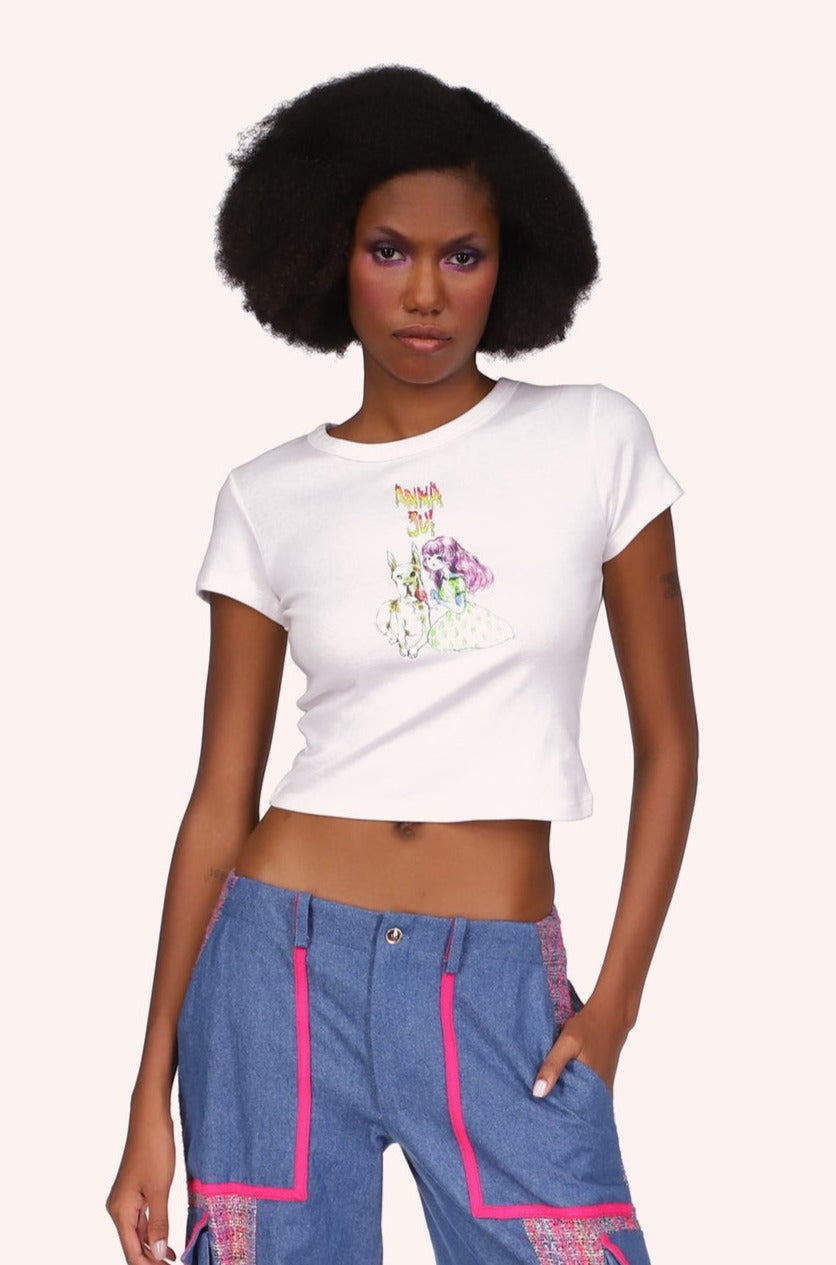 White tee, Short-sleeved, above the hips, A. S. logo above a stylized little girl with a large white dog