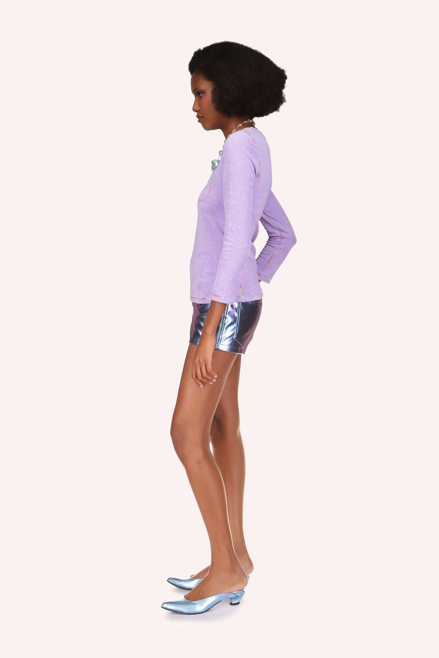 Metallic Faux Leather Shorts, in a hue of blue, fitted short, large stiches hem on sides