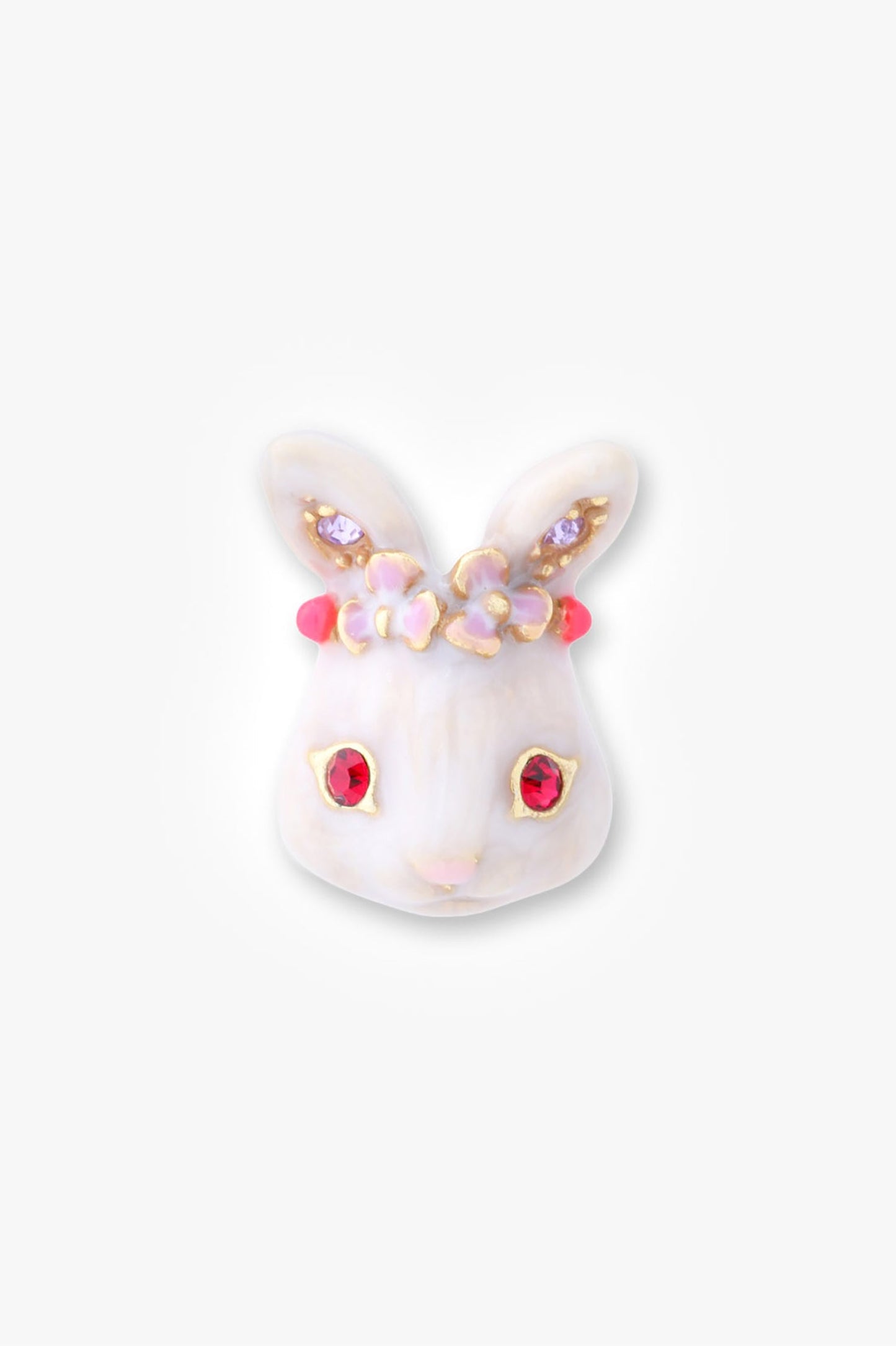 Detail of one white enamel rabbit charm with red eye gems, purple ear gems, and red crown
