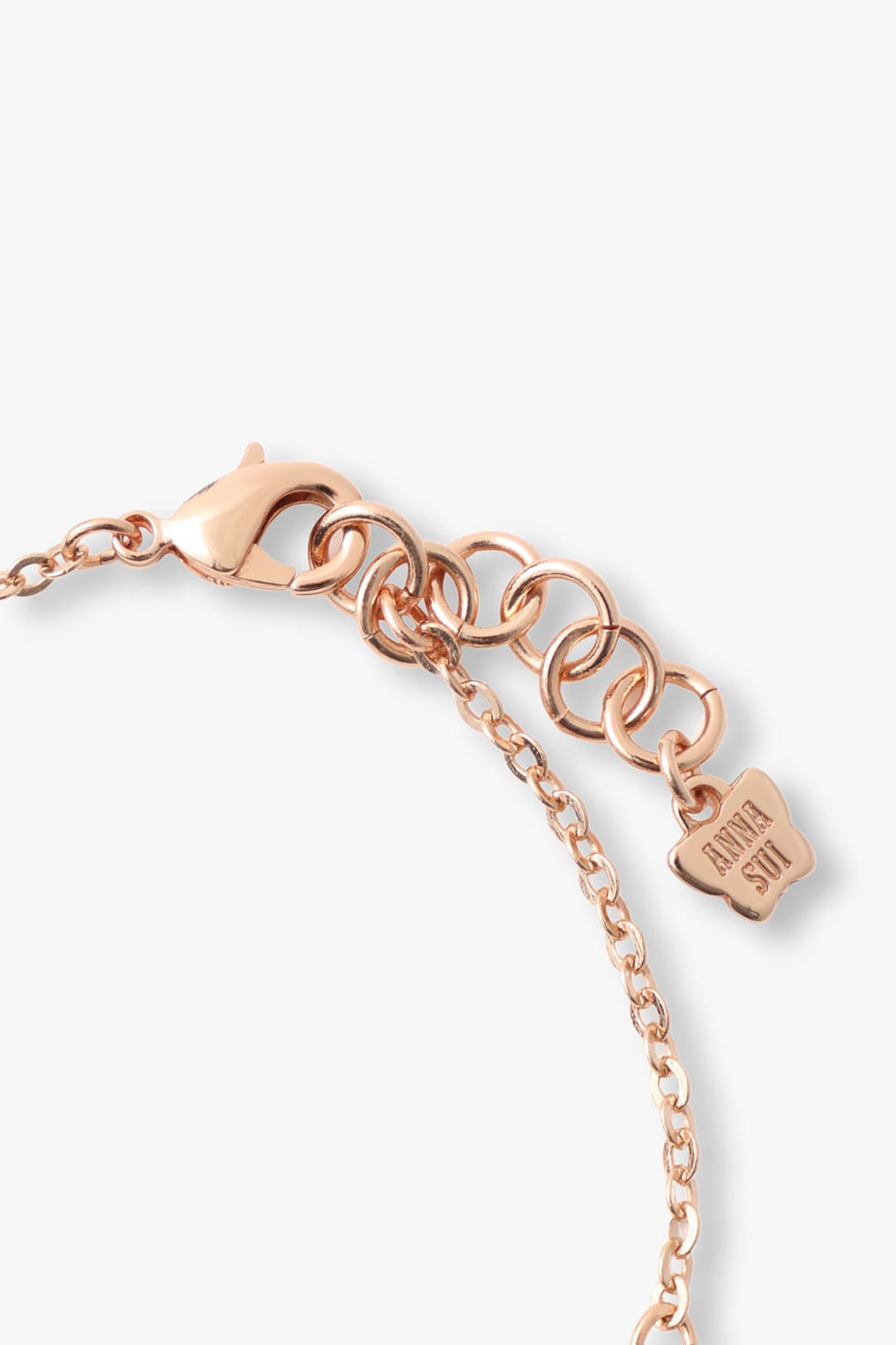 Rose Gold link chain, lobster claw clasp lock, Anna Sui imprint logo at the end