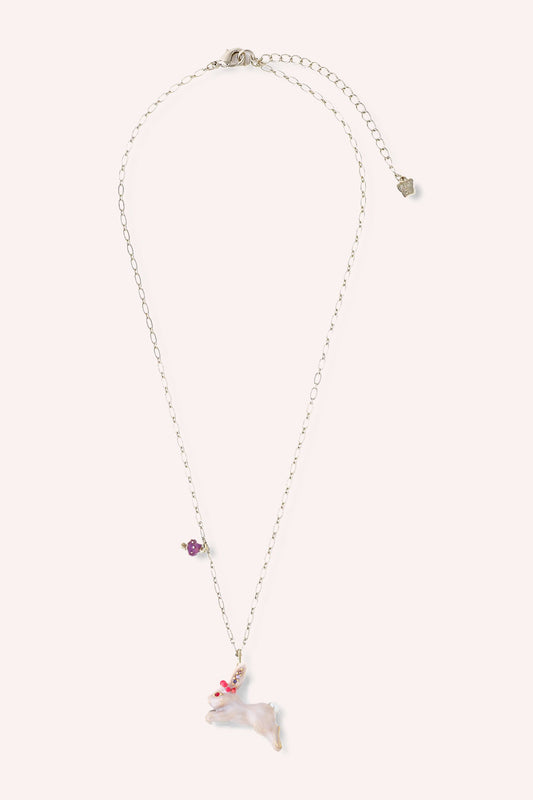 Necklace, Gold toned chain, white rabbit charm with red eye gems, purple ear gems, and red crown