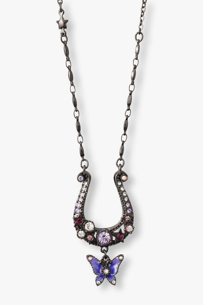 Gunmetal horseshoe with Gems and glass, and a purple butterfly pendant