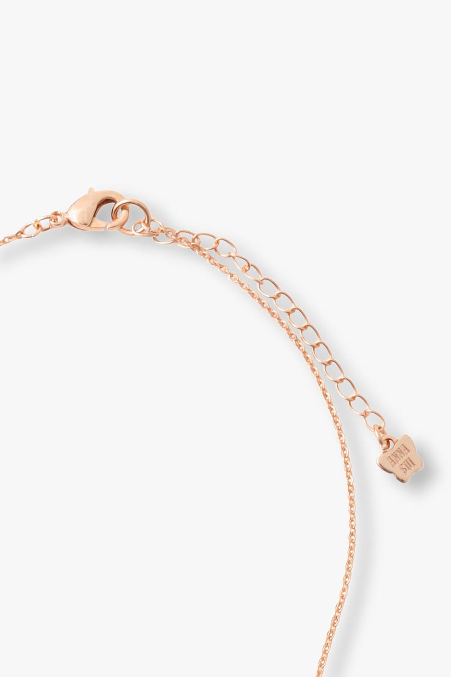 Rose Gold chain, lobster claw clasp lock, Anna Sui imprint logo at the end