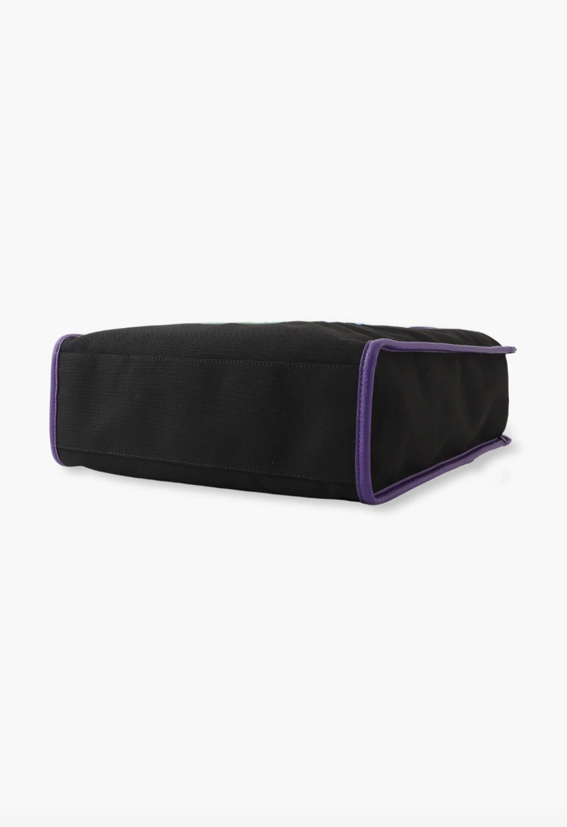 Peacock Tote Bag in back reinforced bottom is in plain black, hems are in purple