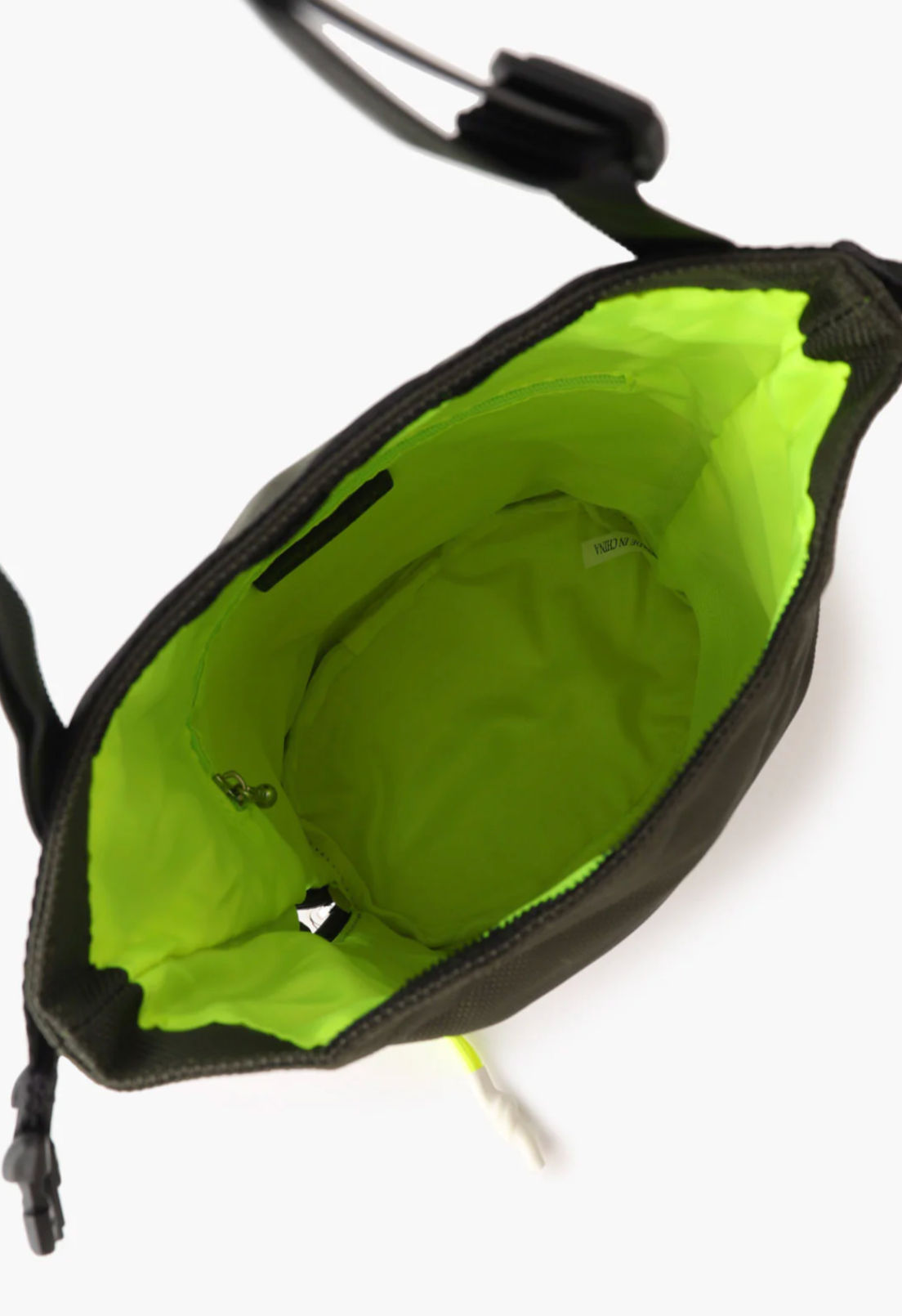 The Anyone Bucket Bag, open shows a neon green and large capacity, side zipper pocket