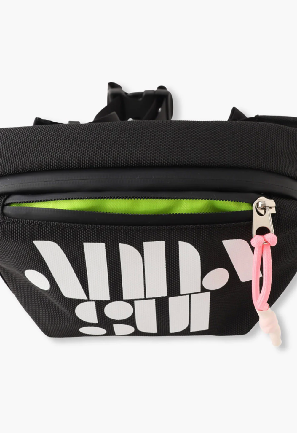 The Anyone Fanny Pack has a small front pocket in a glo-green and large main body pocket