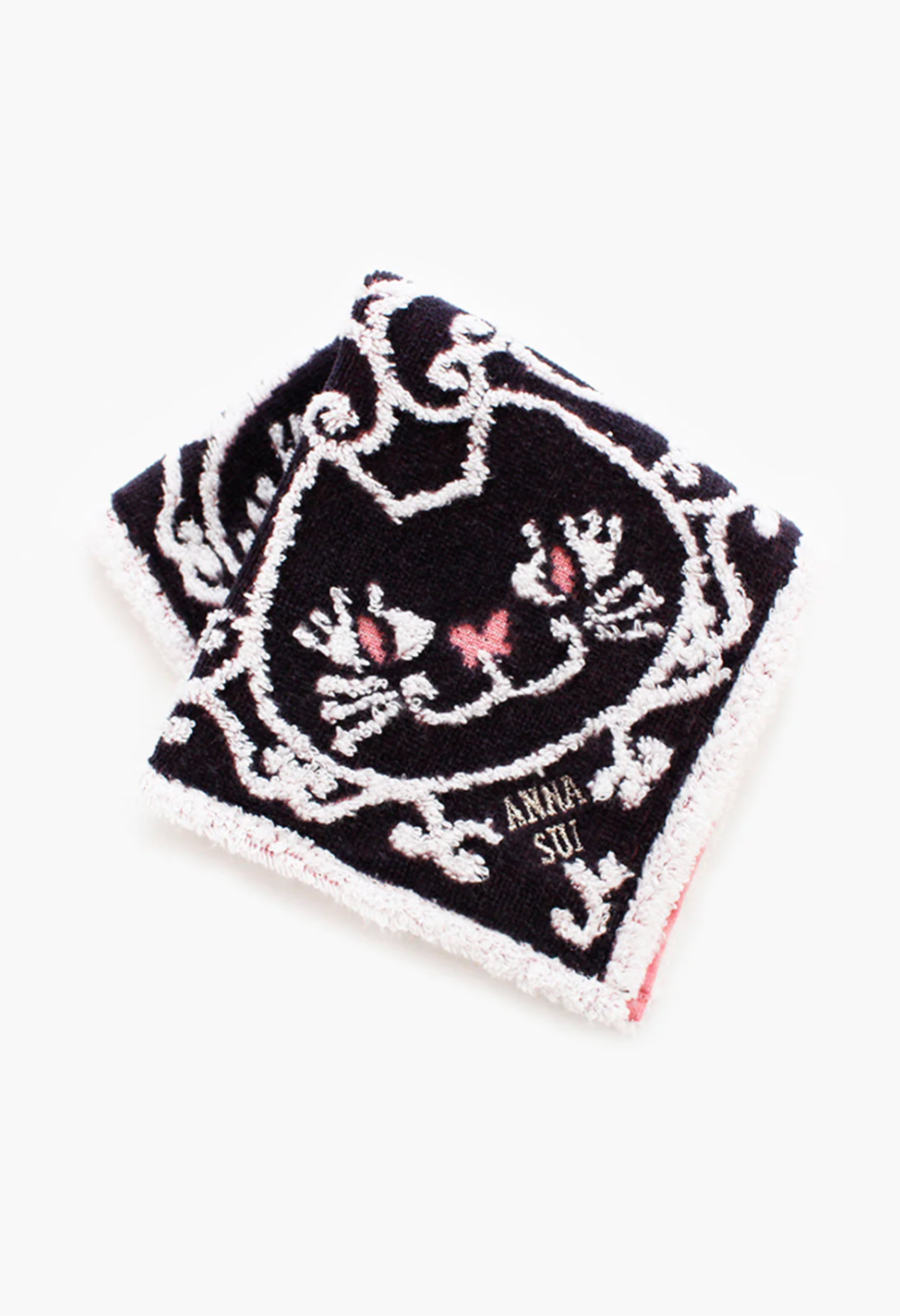 Cat Pattern Washcloth black, detail of white/pink cat pattern, Anna Sui's label in the right corner 