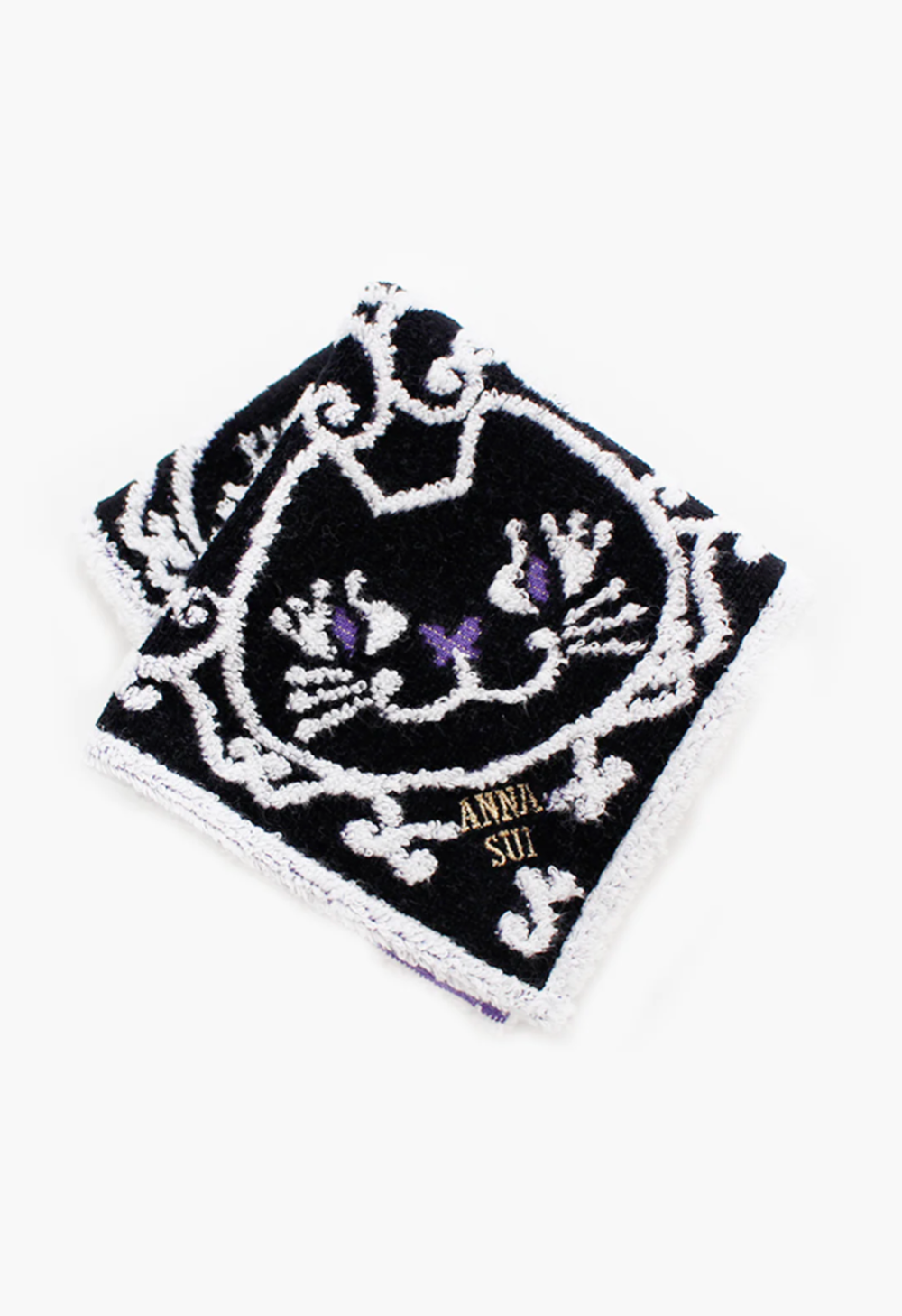 Cat Pattern Washcloth in black, detail of white/purple cat pattern, Anna Sui's label in the corner 