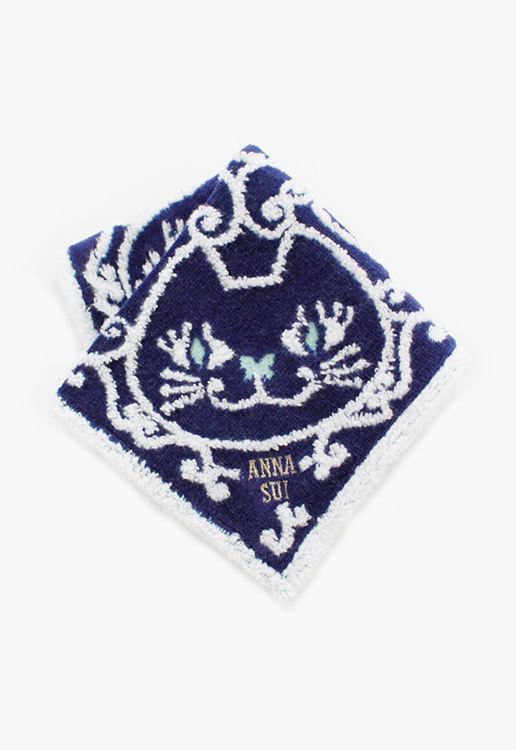 Cat Pattern Washcloth navy, detail of white and purple cat pattern, Anna Sui's label in the corner 