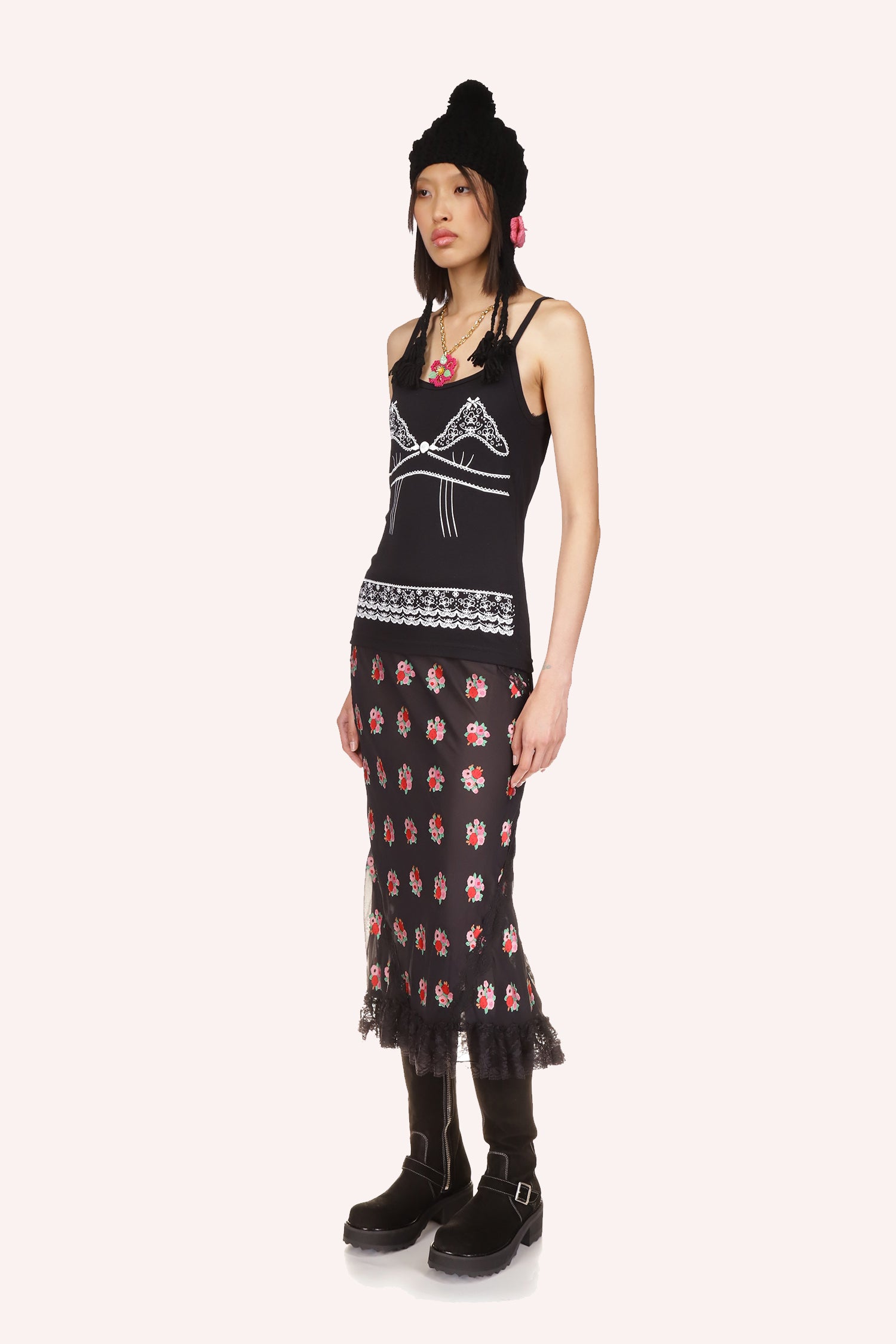 The Anna Sui's Rosie Posie Skirt Black is under knee long, with see-through effect from the knee down, black lace at bottom