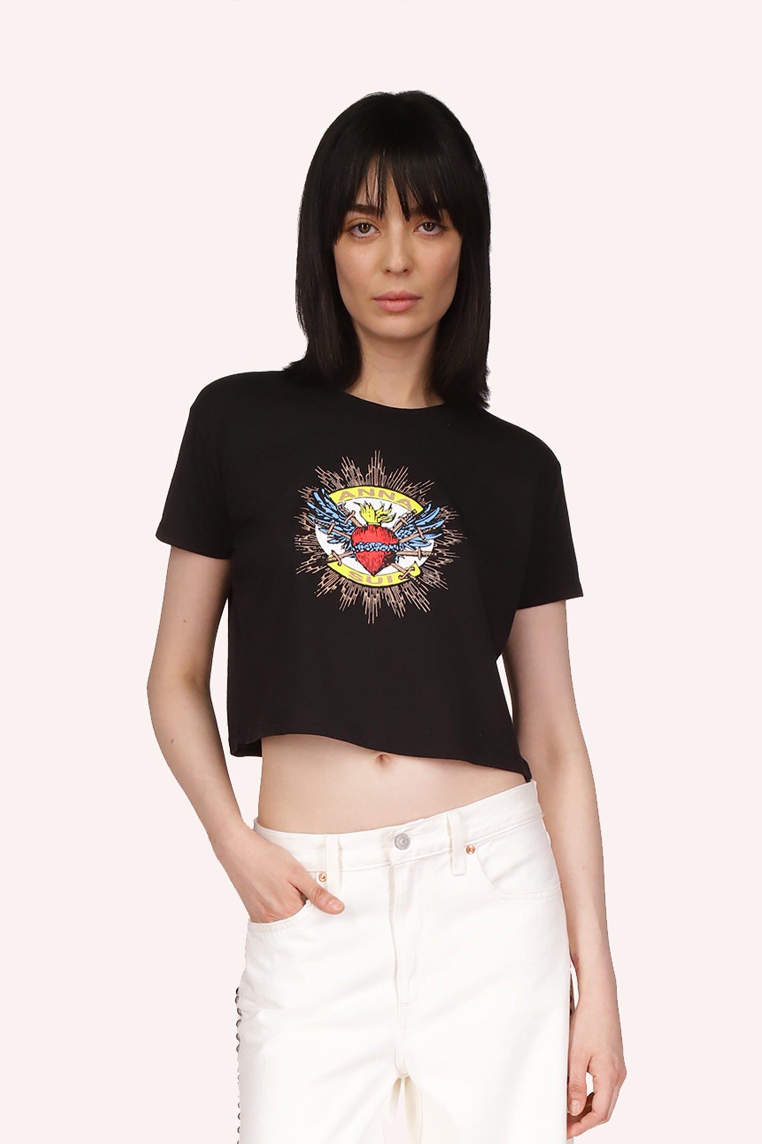 The Anna Sui Sacred Heart Cropped T-Shirt in Black Multi is a short-sleeved t-shirt, which ends above the belly button