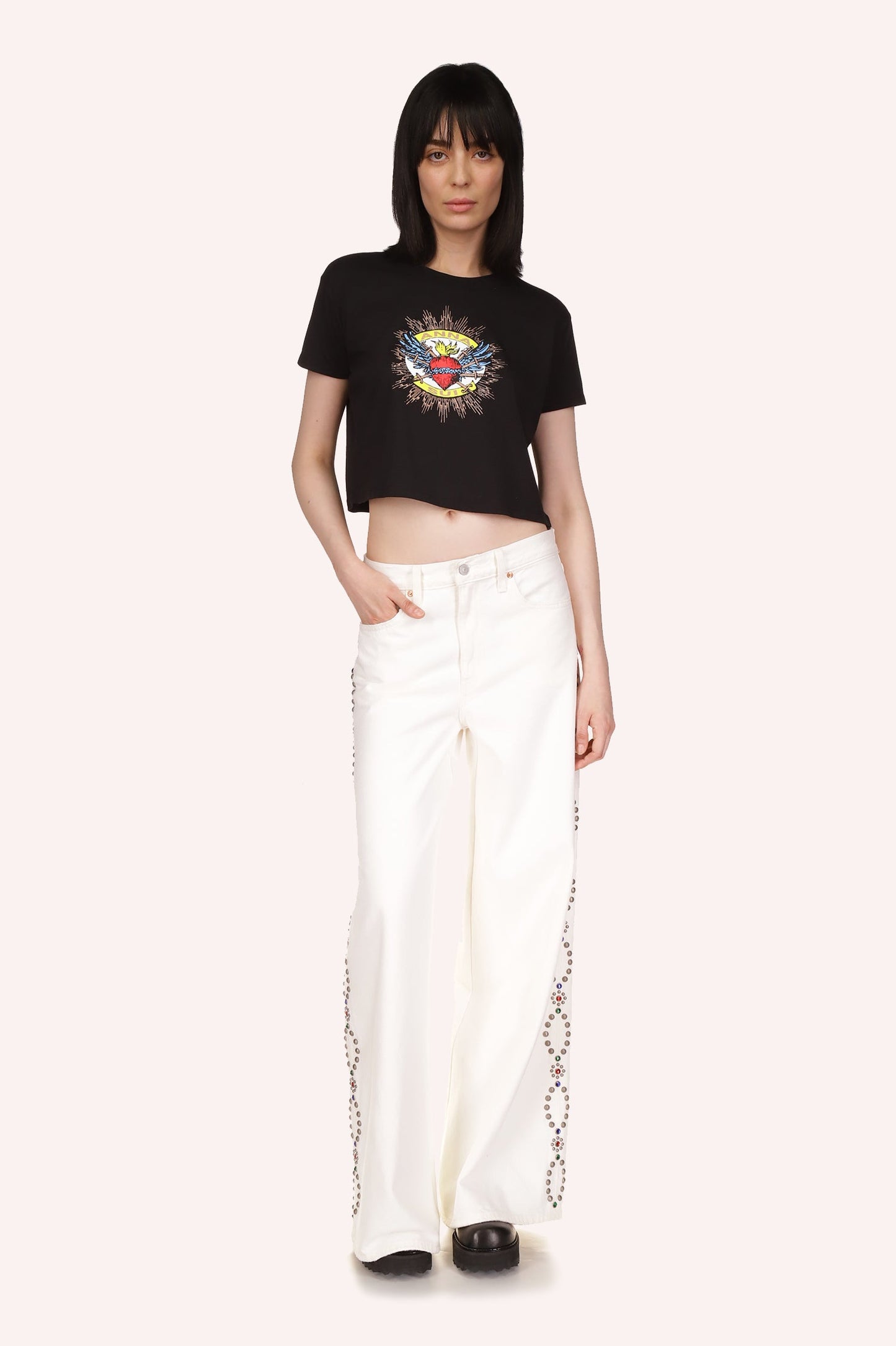 On a black background, Sacred Heart in the middle of the t-shirt, Anna Sui label in the print