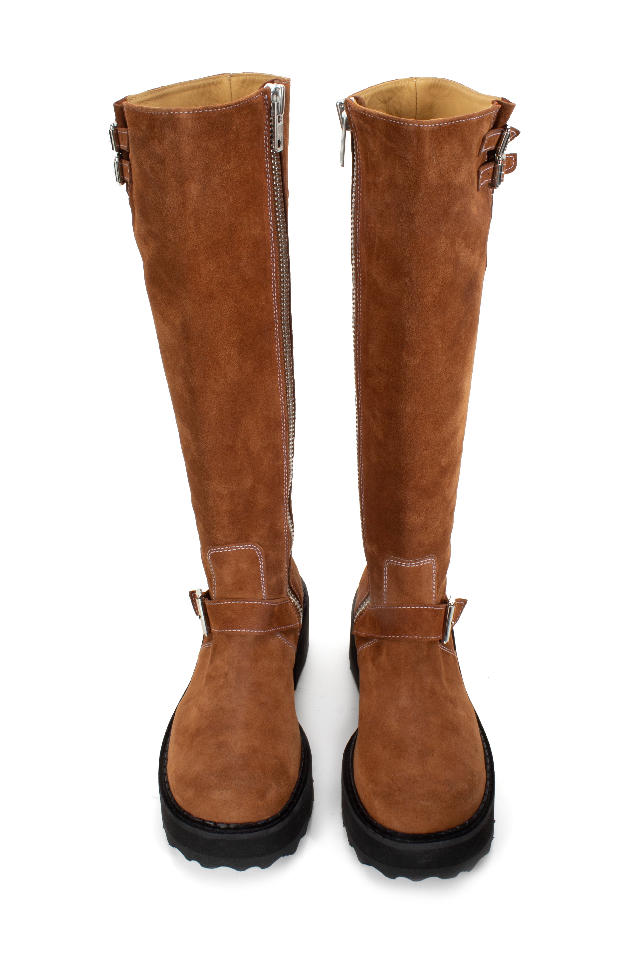Boot in brown is an under-the-knee-high, suede boot with a leather top sole and a heel height of 1.5". 