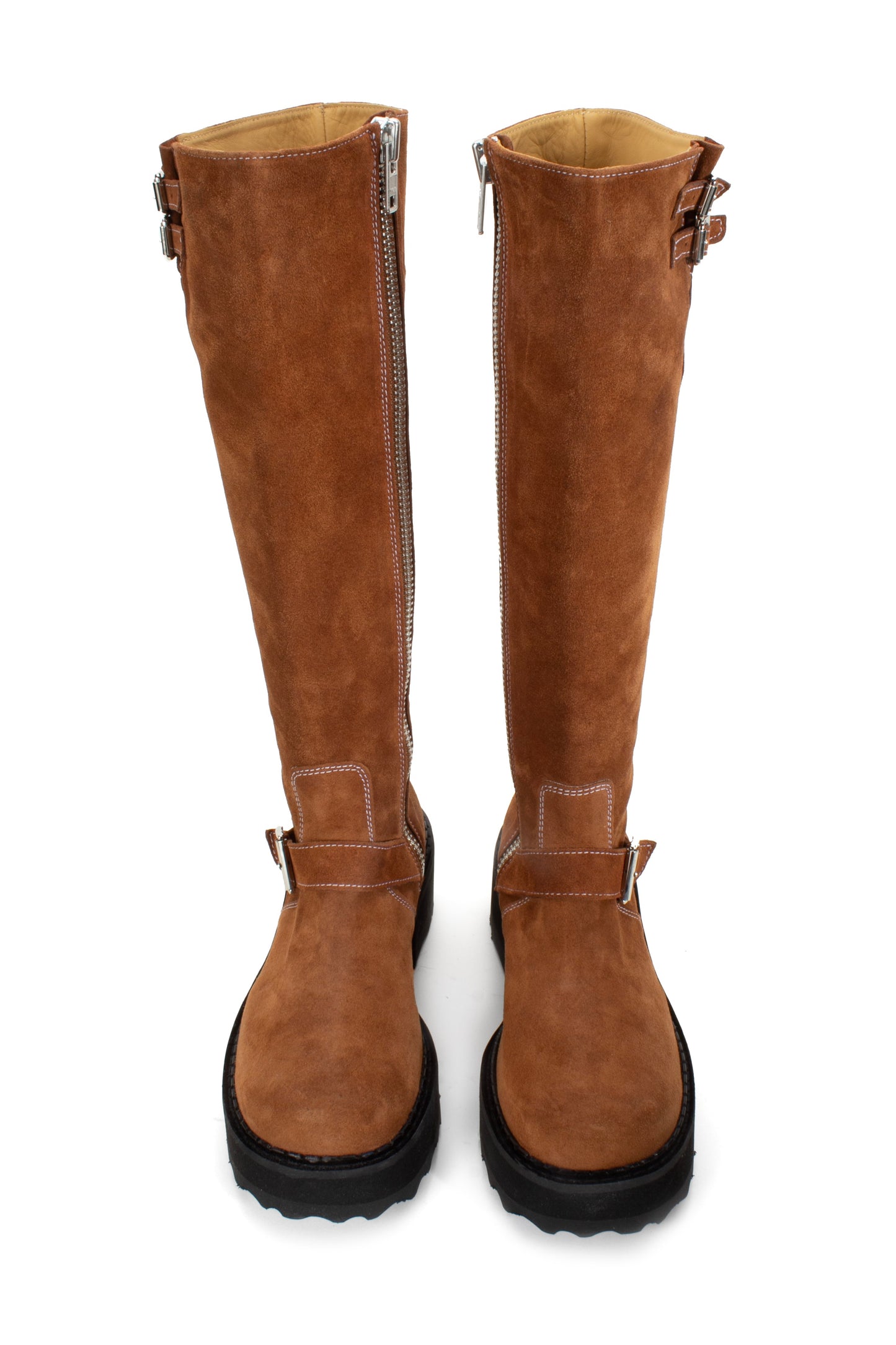 Boots in Brown are an under-the-knee-high, silver buckles with white stiches