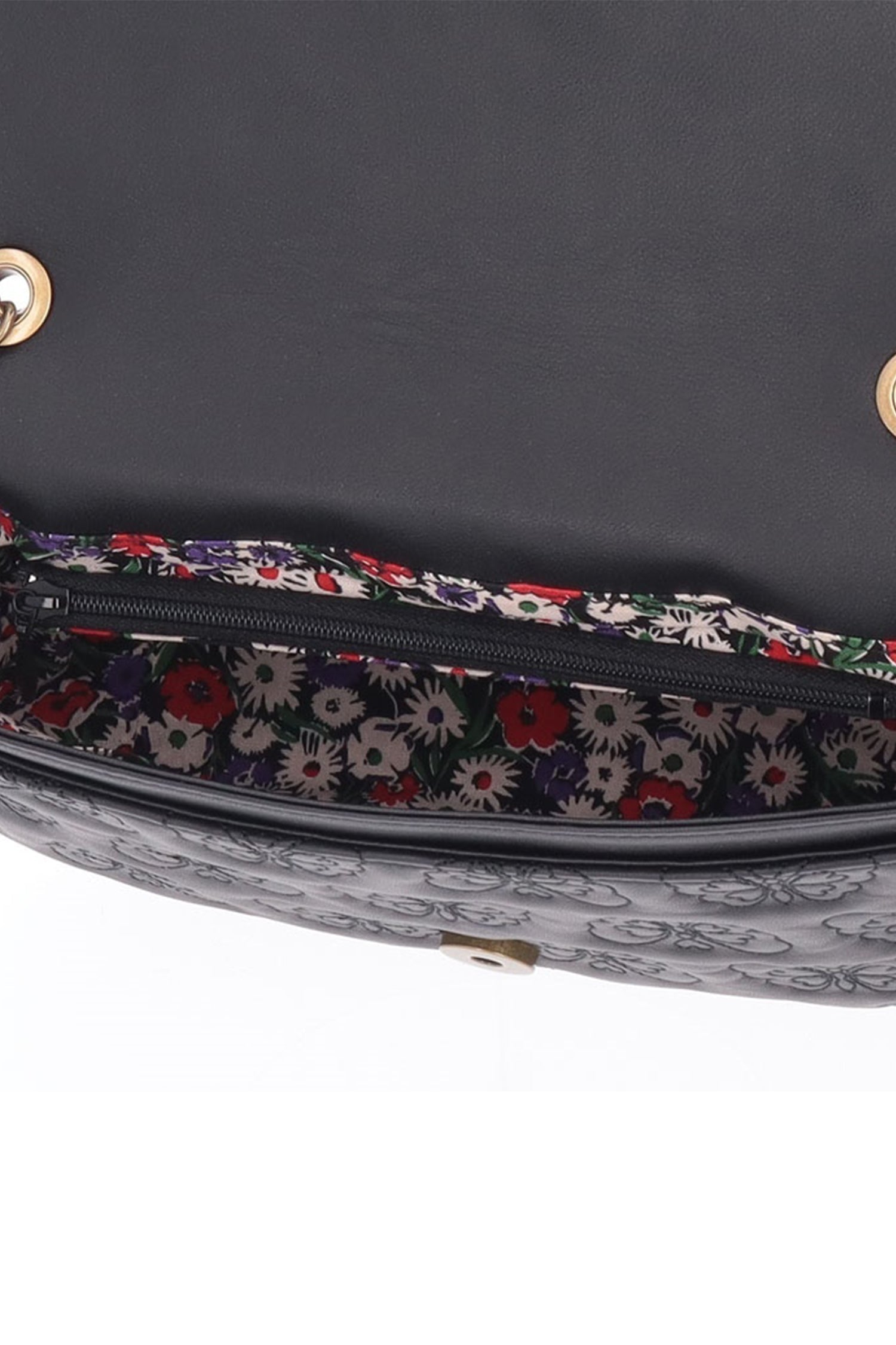 Floral fabric in a main compartment, 1 zipper pocket, 2-open pocket with 2 slots for extra storage