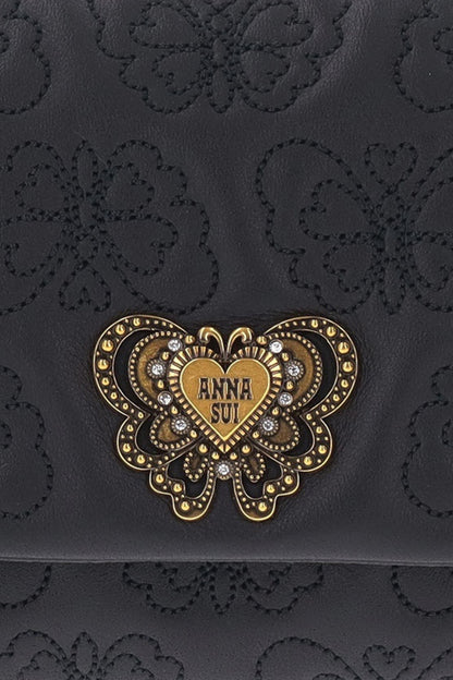 Detail of Anna Sui golden and gems butterfly hardware on flap, Butterfly embossed on leather  