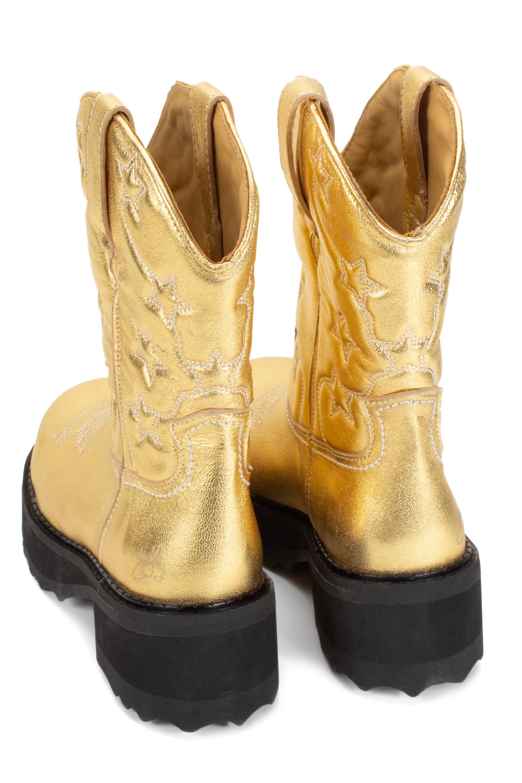 Western-style appearance, engraved lone stars front and back, boots have a high black sole and are signed by John Fluevog