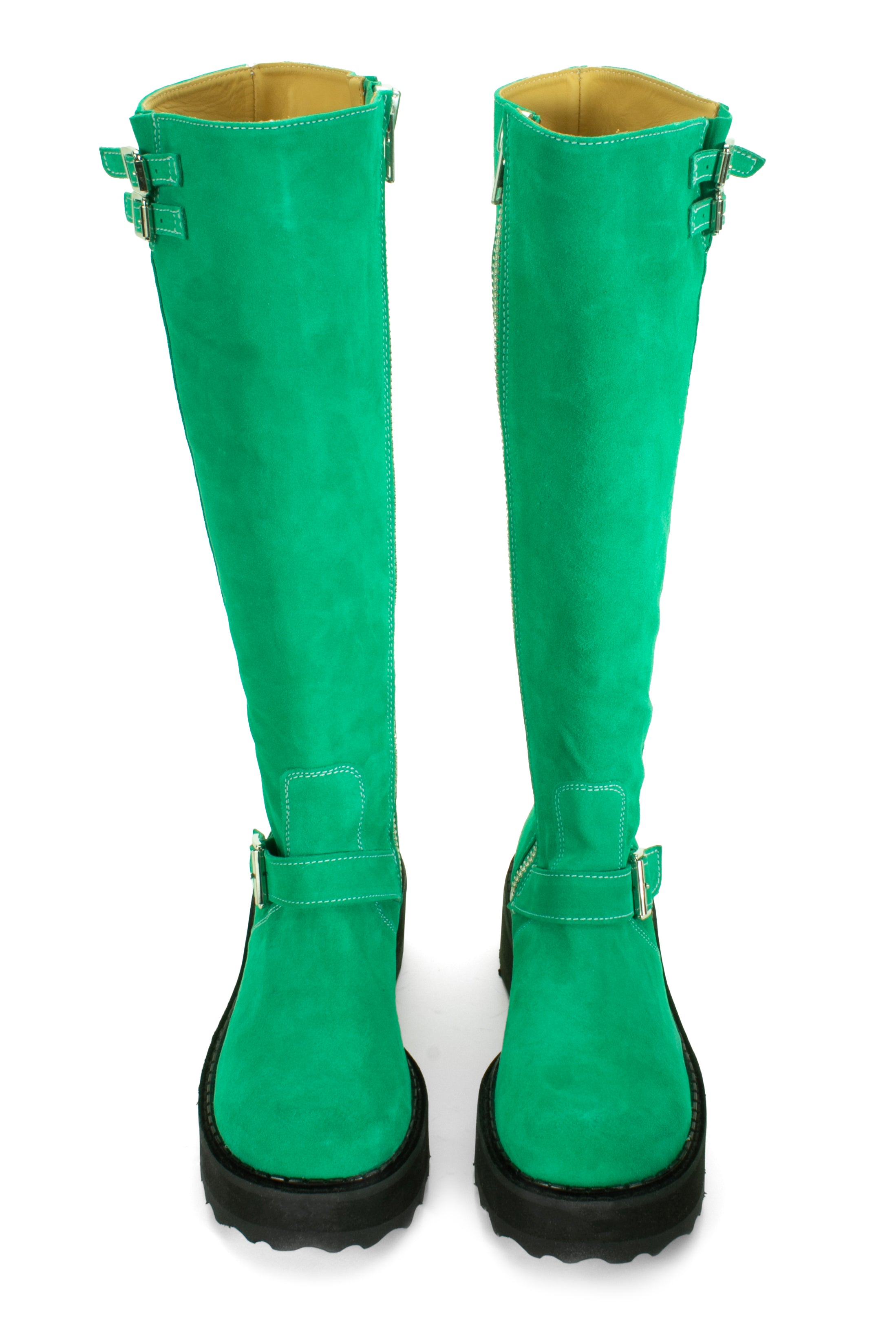 Boot in green is an under-the-knee-high, suede boot with a leather top sole and a heel height of 1.5". 