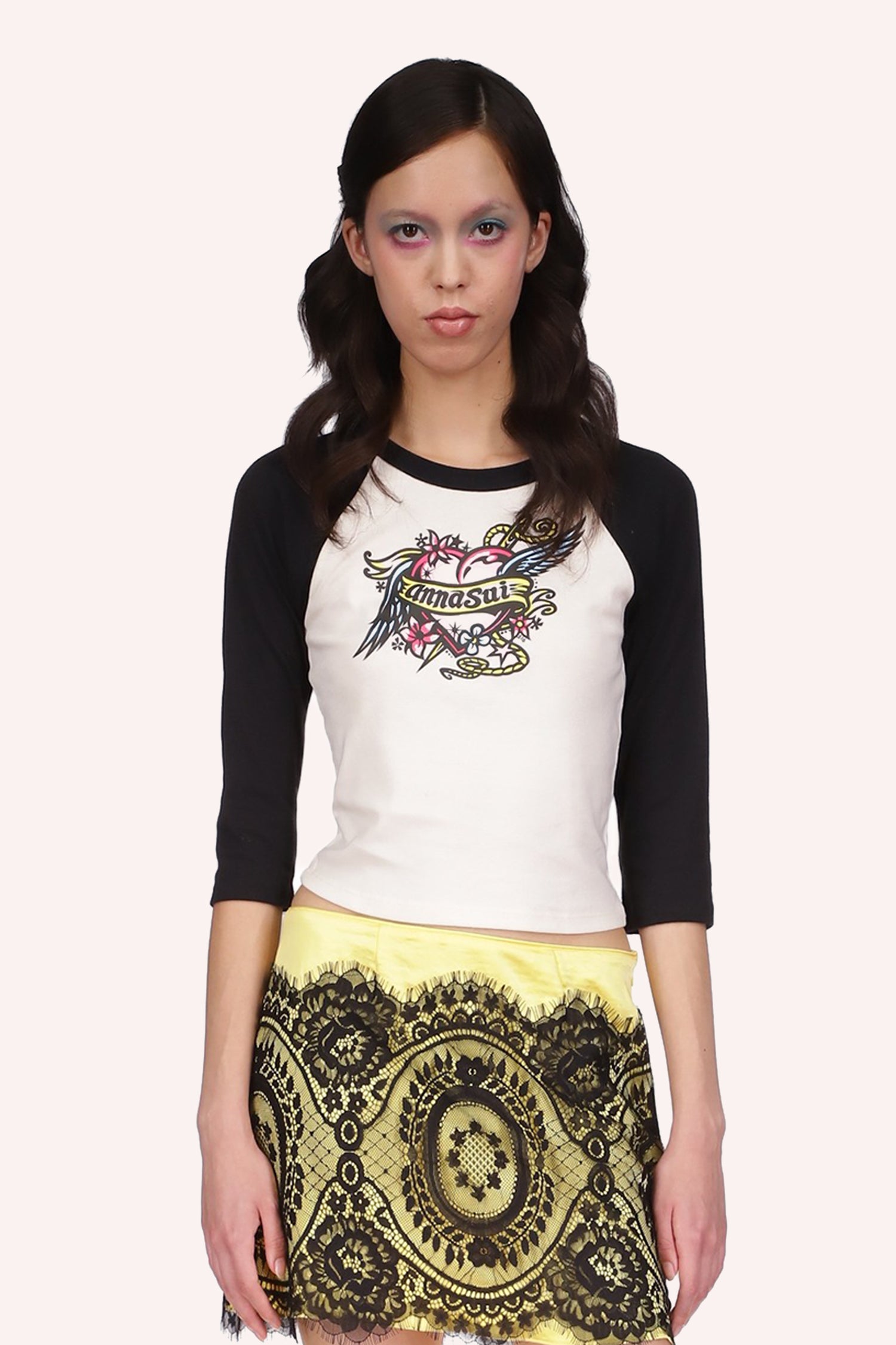 Cropped Three Quarter Sleeve Tee Black, front is white, an heart with wings, floral design and Anna Sui on a banner