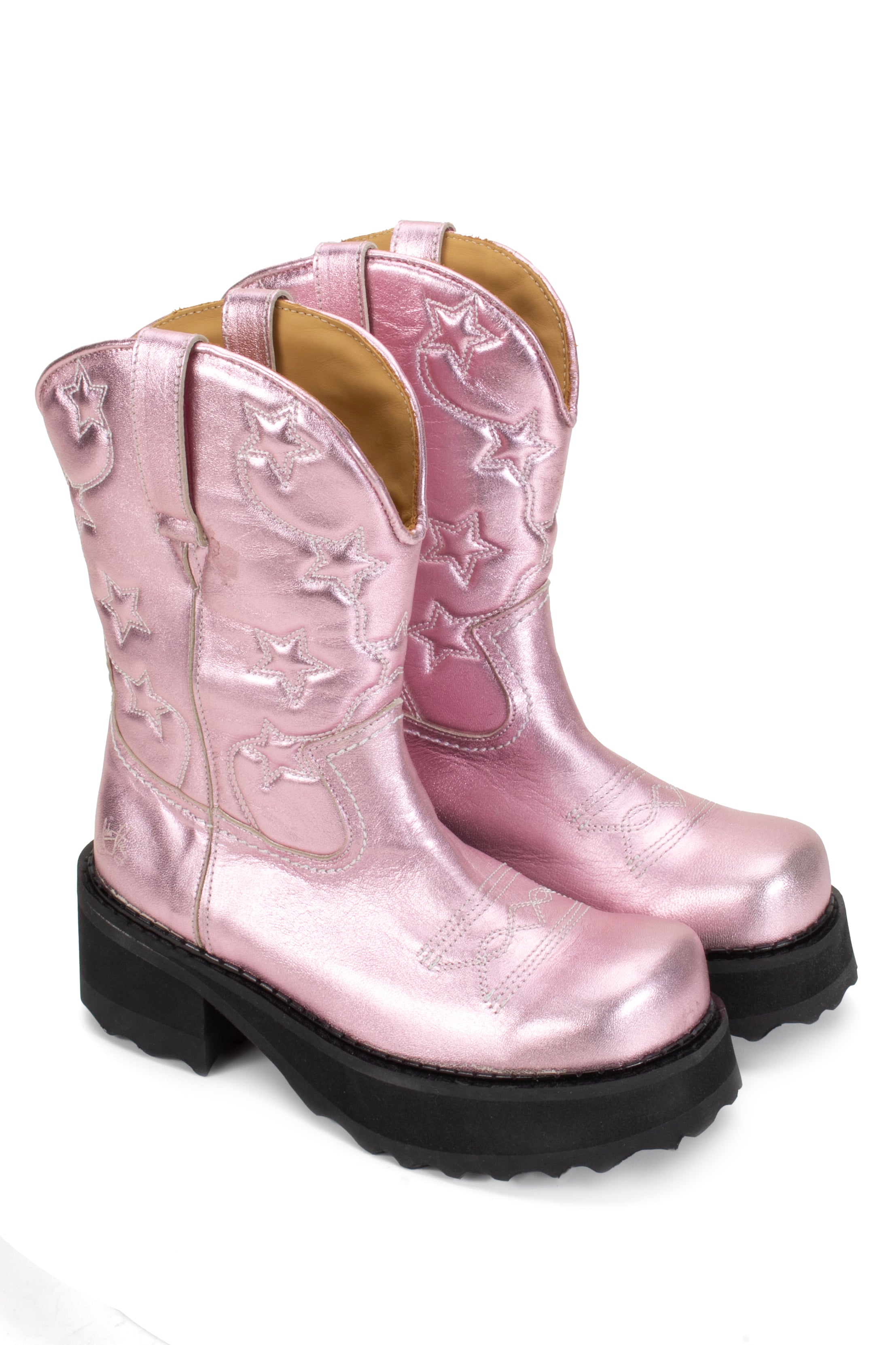 The Anna Sui x John Fluevog Ankle Cowboy Boot, are a pair of pink-colored cowboy-style boots with a high black sole