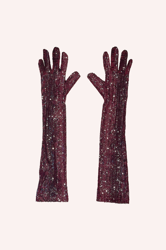 I guanti in pelle di serpente con lustrini sono un paio di guanti lucidi lunghi fino al gomito di colore rosso rubino.