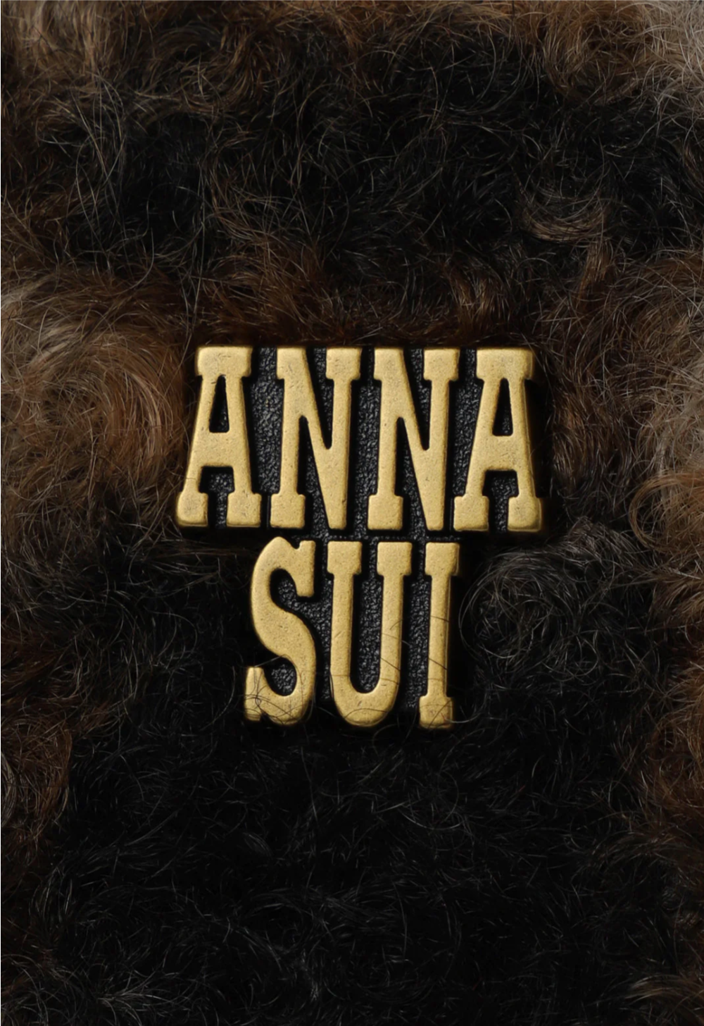 Sunflower Tote with Anna Sui's artist label in golden font on a brown plaid fur print 